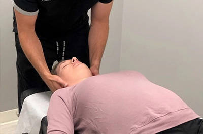 Chiropractor Elmhurst IL Female Patient Receiving An Adjustment HP
