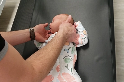 Chiropractor Elmhurst IL Infant Patient Receiving An Adjustment HP