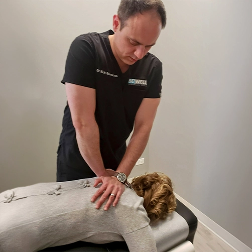 Chiropractor Nick Bournazos Adjusting A Patient